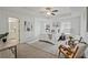 Bright main bedroom with tray ceiling, carpet flooring, ceiling fan, and ensuite bathroom at 2235 Mulsanne Dr, Lithonia, GA 30058