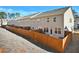 Fenced backyard of a townhouse with a spacious, partially shaded lawn at 2240 Mulsanne Dr, Lithonia, GA 30058
