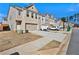 Street view of a townhouse complex featuring attached garages, and well-kept landscaping at 2240 Mulsanne Dr, Lithonia, GA 30058
