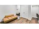 Finished basement includes a stylish couch, large closet, and an office area at 2304 Isla Run Run, Woodstock, GA 30188
