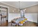 Dining room with modern lighting, hardwood floors, and ample seating for Gathering gatherings and dinner parties at 2304 Isla Run Run, Woodstock, GA 30188