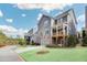 Gray two-story home with an attached garage and a charming covered back porch at 2304 Isla Run Run, Woodstock, GA 30188