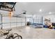 Spacious garage with ample storage and a high ceiling is ideal for storing a trampoline and bikes at 2304 Isla Run Run, Woodstock, GA 30188