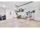 Spacious garage with high ceilings and ample overhead storage racks at 2304 Isla Run Run, Woodstock, GA 30188