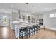 Spacious kitchen with gray cabinets, stainless appliances, and a center island with barstool seating at 2304 Isla Run Run, Woodstock, GA 30188
