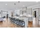 Bright kitchen featuring an island with bar stool seating and stainless steel appliances at 2304 Isla Run Run, Woodstock, GA 30188