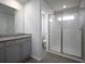 Stylish bathroom featuring a shower and granite vanity, as well as an attached powder room at 250 Shawnee Trl, Dallas, GA 30157