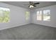 Spacious bedroom with plush carpeting, neutral paint, and plenty of natural light from the multiple windows at 250 Shawnee Trl, Dallas, GA 30157