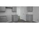 Well-appointed kitchen with gray cabinetry, granite countertops, and white subway tile backsplash at 250 Shawnee Trl, Dallas, GA 30157