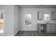 Eat-in kitchen featuring gray cabinets, wood-look floors, and large windows at 250 Shawnee Trl, Dallas, GA 30157