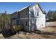 Back exterior of the house with a wooden deck at 250 Shawnee Trl, Dallas, GA 30157