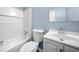 Well-lit bathroom with a combination tub and shower at 414 Landers Sw Dr, Mableton, GA 30126