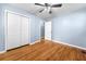 Bedroom with hardwood floors, ceiling fan, and closet at 414 Landers Sw Dr, Mableton, GA 30126