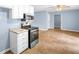 Open kitchen area with stainless steel appliances and an arched entryway at 414 Landers Sw Dr, Mableton, GA 30126