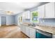 Open kitchen area featuring stainless steel sink and lots of natural light at 414 Landers Sw Dr, Mableton, GA 30126