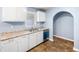 Charming kitchen with white cabinetry, granite countertops, stainless steel sink and stainless steel dishwasher at 414 Landers Sw Dr, Mableton, GA 30126