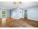 Open living room with hardwood floors, a ceiling fan, and lots of natural light at 414 Landers Sw Dr, Mableton, GA 30126