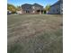 Spacious backyard with newly installed sod and a view of the home's exterior at 5000 Fairview Cir, Villa Rica, GA 30180