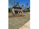 Charming two-story home with a landscaped yard and brick facade at 5000 Fairview Cir, Villa Rica, GA 30180