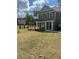 Beautiful home with lush lawn and mature landscaping with a covered front porch at 5000 Fairview Cir, Villa Rica, GA 30180