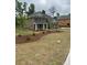 Charming new construction home featuring a landscaped front yard and covered entryway at 5000 Fairview Cir, Villa Rica, GA 30180