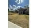 A new home boasts lush front yard with newly installed sod and fresh landscaping at 5000 Fairview Cir, Villa Rica, GA 30180