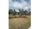 New construction home with a lush lawn, landscaped front yard, and a covered entry at 5000 Fairview Cir, Villa Rica, GA 30180