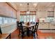 Light-filled dining area features window views, blinds, and cabinetry at 630 Cleburne Ne Ter, Atlanta, GA 30306