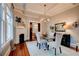 Elegant dining room with hardwood floors, a fireplace, a glass table, and seating for four at 630 Cleburne Ne Ter, Atlanta, GA 30306