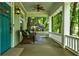Inviting porch with seating area and view of the surrounding greenery at 630 Cleburne Ne Ter, Atlanta, GA 30306