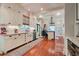 Bright kitchen features custom cabinets, stainless appliances, and hardwood floors at 630 Cleburne Ne Ter, Atlanta, GA 30306