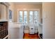 Laundry room featuring a washer, dryer, shelving, and a window that provides natural light at 630 Cleburne Ne Ter, Atlanta, GA 30306