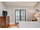 Bedroom featuring hardwood floors, natural light and french door access at 630 Cleburne Ne Ter, Atlanta, GA 30306