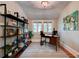 Well-lit home office with built-in bookshelves, a large window, and hardwood floors at 630 Cleburne Ne Ter, Atlanta, GA 30306