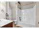 Bathroom featuring a tub/shower combo with a shower rod, vanity with marble top, and vinyl flooring at 845 Nevis Way, Mcdonough, GA 30253