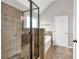 Bathroom featuring a glass shower with tile and a soaking tub at 845 Nevis Way, Mcdonough, GA 30253