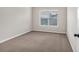 Bright bedroom featuring carpet flooring and a window that brings in natural light at 845 Nevis Way, Mcdonough, GA 30253