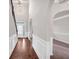 Open foyer with hardwood floors, staircase, and view into dining room at 845 Nevis Way, Mcdonough, GA 30253