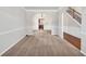 Spacious living room features an open layout that brings lots of natural light and neutral wall color at 845 Nevis Way, Mcdonough, GA 30253