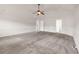 Spacious main bedroom offers plenty of closet space, carpeted floor, and neutral wall color at 845 Nevis Way, Mcdonough, GA 30253