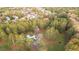 Aerial view of home nestled on a large lot surrounded by mature trees at 935 Old Loganville Rd, Loganville, GA 30052