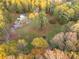 Aerial view of home and expansive wooded property at 935 Old Loganville Rd, Loganville, GA 30052