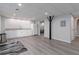 Finished basement with recessed lighting, kitchenette, and gray wood-look flooring at 935 Old Loganville Rd, Loganville, GA 30052