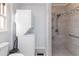 Bathroom with shower and stacked washer/dryer at 935 Old Loganville Rd, Loganville, GA 30052