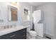 Bathroom featuring stylish vanity, a stacked washer/dryer and modern fixtures at 935 Old Loganville Rd, Loganville, GA 30052