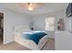 Cozy bedroom with soft carpet, a ceiling fan, and natural light from the window at 935 Old Loganville Rd, Loganville, GA 30052