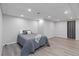 Spacious bedroom with hardwood floors, recessed lighting, and a large window at 935 Old Loganville Rd, Loganville, GA 30052