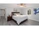 Comfortable bedroom with neutral paint, ceiling fan, and hardwood floors at 935 Old Loganville Rd, Loganville, GA 30052