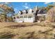 Inviting front porch and screened in area, perfect for relaxing outdoors at 935 Old Loganville Rd, Loganville, GA 30052