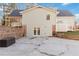 Back of house with backyard patio, retaining wall and well maintained yard at 935 Old Loganville Rd, Loganville, GA 30052